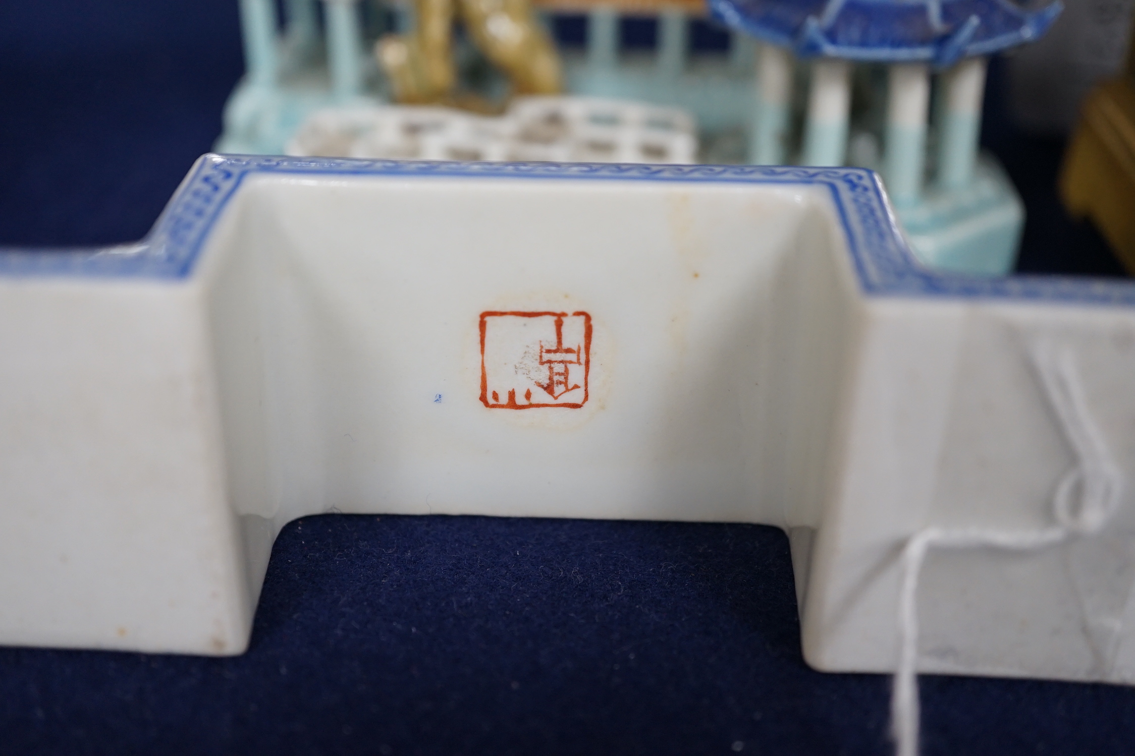 A Chinese model of pavilions and an enamelled porcelain ink stand, 12.5cm